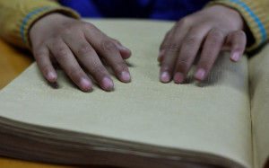 Reading braille at China Braille Library